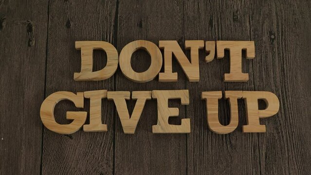 Don't give up, text words typography written with wooden letter, life and business motivational inspirational