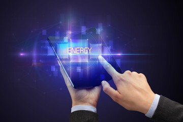 Businessman holding a foldable smartphone