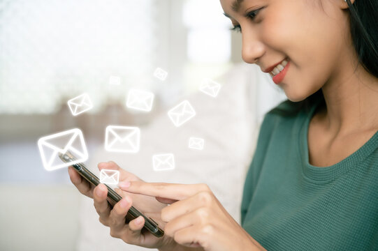 Asian woman hand using mobile phone with e-mail application, Concept email and newsletter