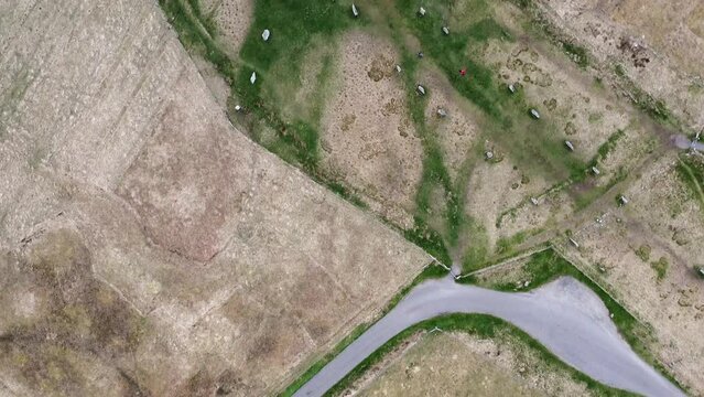 Birds-eye-view drone shot of the Callanish Standing Stones. Filmed on the Isle of Lewis, part of the Outer Hebrides of Scotland.