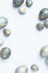 Blue Easter eggs frame. Light Easter background or elegant greeting card, copy space.