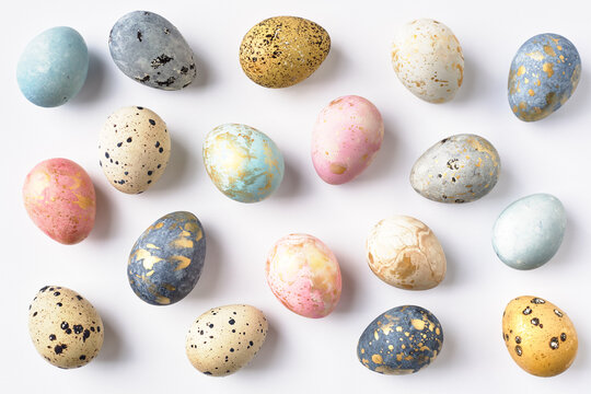 Dyed colorful pastel Easter eggs pattern on white background. Easter greeting card.