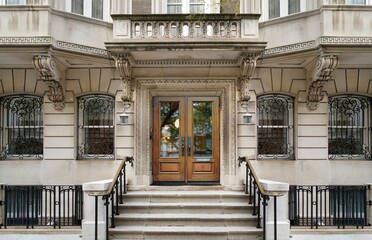 Entrance to elegant New York apartment building with stone detailing