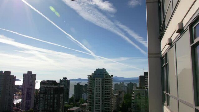 Downtown Vancouver, British Columbia, Canada chemtrails in the sky