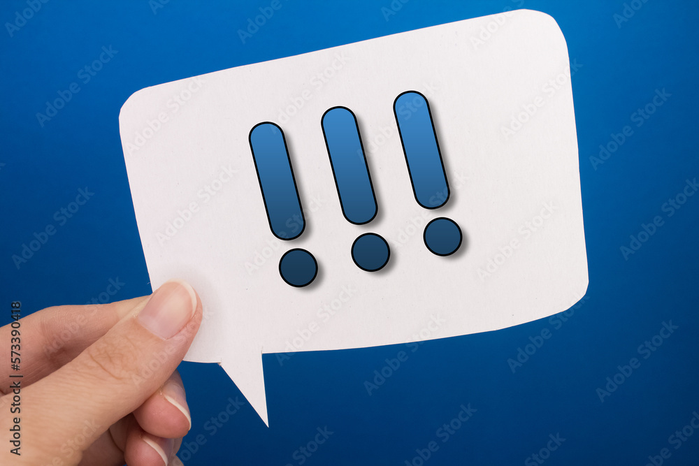 Poster speech bubble in front of colored background with exclamation mark text.