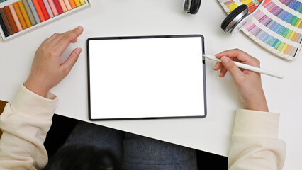 Top view of a female graphic designer using digital tablet to design her project. tablet mockup