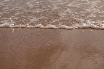 Sand and waves close up texture