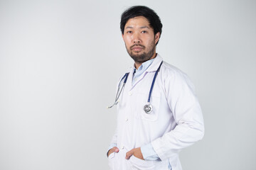 Asian man in Doctor uniform on white background in hospital