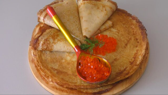 Pancakes with red caviar, cooked for Maslenitsa. Maslenitsa is an East Slavic traditional holiday celebrated during the week before Lent.