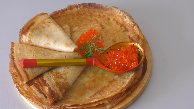 Pancakes with red caviar, cooked for Maslenitsa. Maslenitsa is an East Slavic traditional holiday celebrated during the week before Lent.