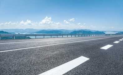 Asphalt road and green mountain nature background