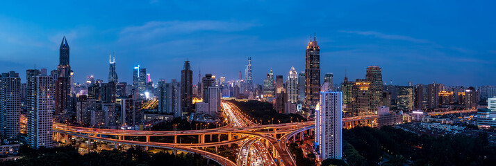 Fototapeta premium Aerial view of city skyline and modern buildings in Shanghai at night, China.