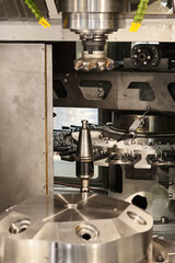 Lathe machine tool with cooling system in metalworking plant