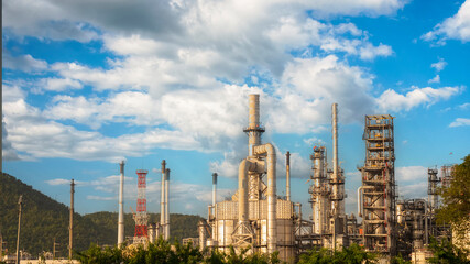 Fototapeta premium Oil refinery gas petrol plant industry with crude tank, gasoline supply and chemical factory. Petroleum barrel fuel heavy industry oil refinery manufacturing factory plant. Refinery industry concept