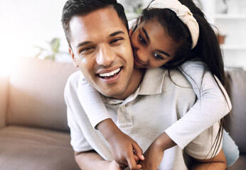 Obraz premium Family, portrait and hug by girl and father on sofa, happy and relax, playing and laughing in living room. Love, face and child embrace parent on couch, cheerful for day off, weekend or relationship