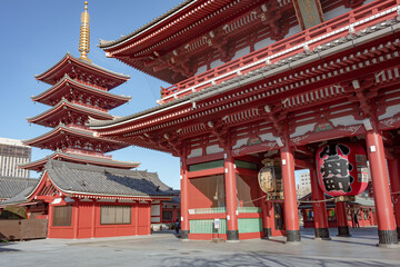 Famous lantern and colorful red and green wood traditional Buddhist temple building complex at Senso-ji Buddhism temple in Asakusa Tokyo