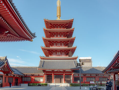 Famous tall pagoda and colorful red and green wood traditional Buddhist temple building complex at Senso-ji Buddhism temple in Asakusa Tokyo