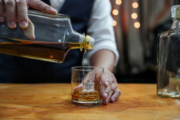 Bartender Serve Whiskey, on wood bar, 