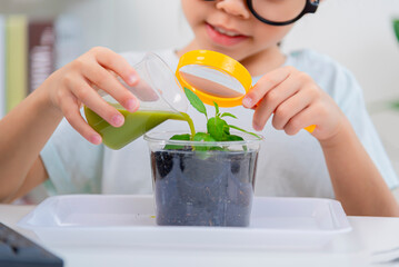 little Girl in biology class learning plants
