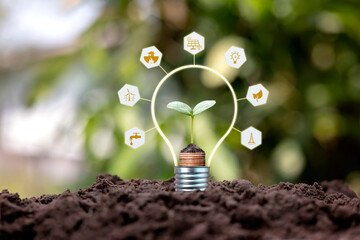 Tree growing on soil and environmentally friendly energy-related icons, earth day concept, and...