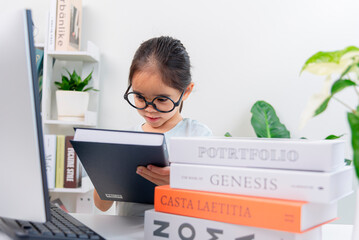 little girl studying with video online