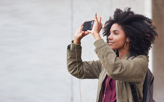 Black woman, phone photography and travel in the city for tourism or sightseeing in the outdoors. Happy African American female tourist taking picture with mobile smartphone in a urban town on mockup