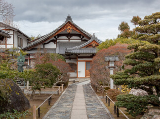 Traditional wooden buddhist temple building exterior architecture and garden of the Tenryu-ji Buddhist temple in Kyoto Japan
