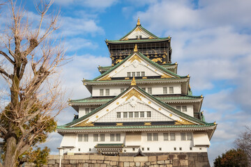 Green and white traditional Japanese architecture building of the Osaka Castle in Osaka Japan