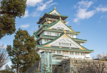 Green and white traditional Japanese architecture building of the Osaka Castle in Osaka Japan