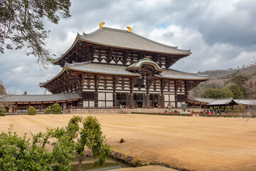 Fototapeta na wymiar Brown wood style temple traditional architecture exterior at the Shi-Tōdai-ji Buddhist Temple historical site in Nara Japan