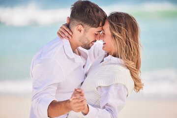 Obraz premium Love, dance and happy with couple on beach for date, romance and anniversary celebration. Smile, bonding and affectionate with man and woman on holiday for hug, vacation and happiness together