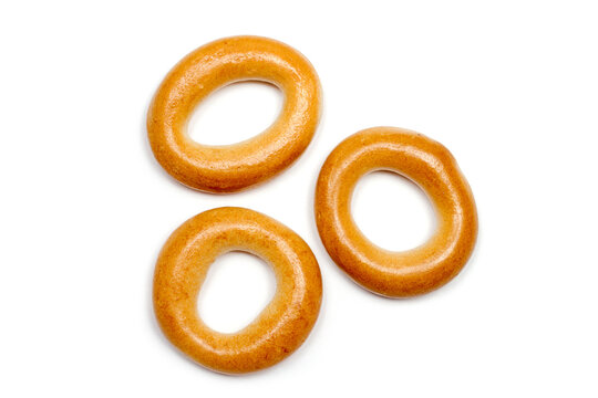 Three small dry bagels on a white background. Bagels close-up.