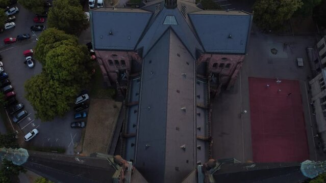 flight from above view down flying between the spiers clearly visible silhouette of the cross