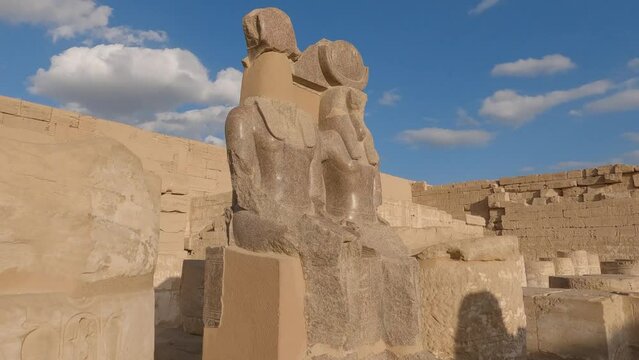 Ancient Egyptian ruins at Medinet Habu - double statue of Maat and Thoth; Egypt