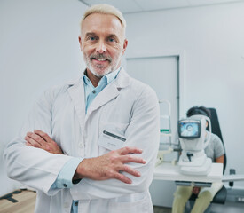 Man, portrait and smile of optometrist with arms crossed in hospital or medical clinic for eye...