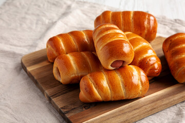 Homemade Kolache Rolls Ready to Eat on a Wooden Board, low angle view. Copy space.