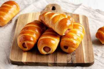 Homemade Kolache Rolls Ready to Eat on a Wooden Board, low angle view. Close-up.