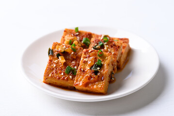 Spicy braised tofu (Dubu Jorim) on white background, Korean side dish