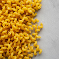Homemade Organic Dried Riccioli Pasta, top view. Flat lay, overhead, from above. Copy space.