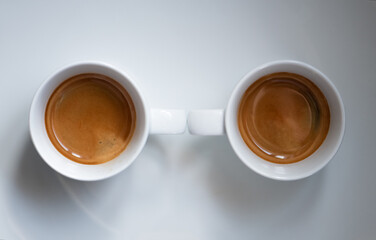 2 Espressos in white cups, white background
