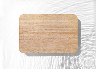 Wooden board on the water surface background. Flat lay, copy space.	