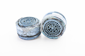 Dirty faucet aerator with limescale, calcified shower water tap with lime scale in bathroom, close...