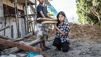 Children working at construction site for world day against child labor concept: