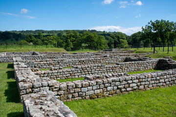 Fototapeta na wymiar Ruins of Chesters Roman fort. Along the route of Hadrian's Wall in Northumberland, UK 