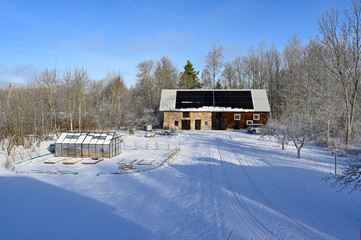 solar panels on barn roof a cold winter day