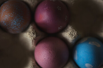 painted easter eggs top view. dark background