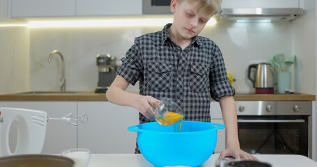Boy cooking an apple pie