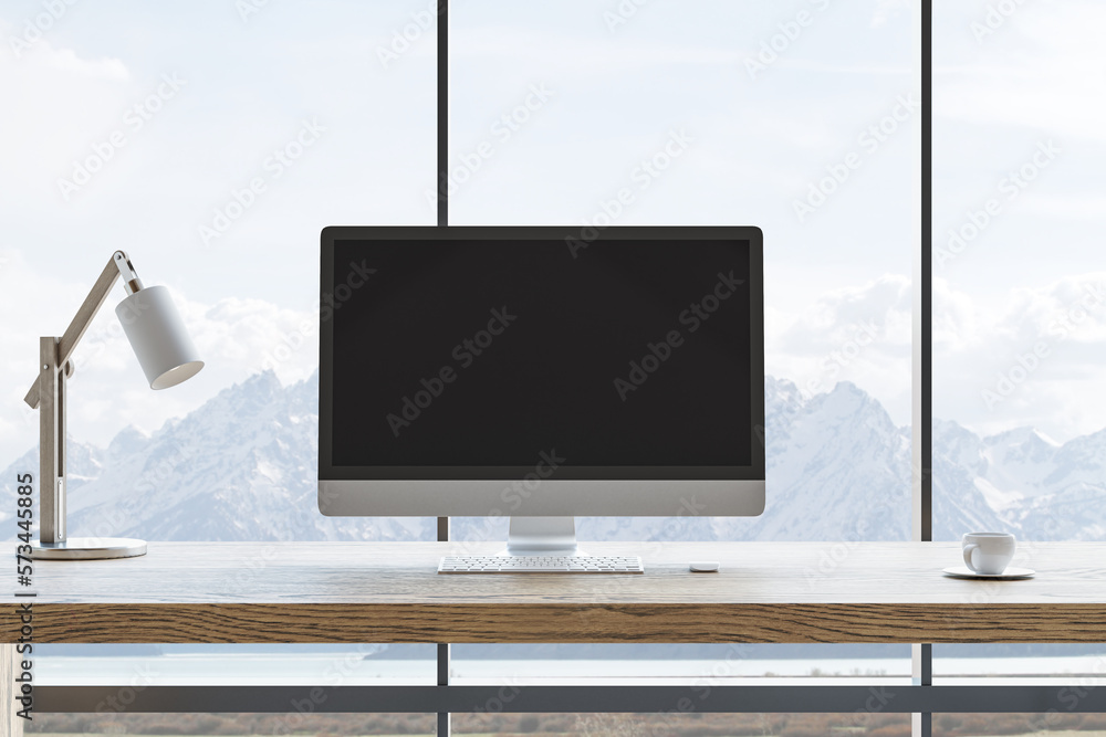 Poster Front view on blank black modern computer monitor with space for your logo or text on wooden work surface table with white lamp on sunlit mountain view from big window. 3D rendering, mock up