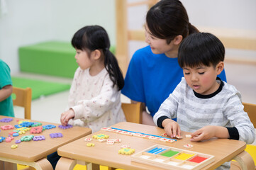 Fototapeta premium Images of children happily learning English