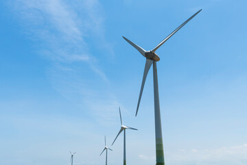 Close-up of wind power systems with blue sky background on the west coast of Taiwan.
